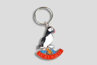 Keychain with puffin design and 'Iceland' text on a white background