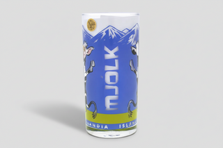Iceland cow glass milk cup with playful cartoon cow design and mountain background, Iceland souvenir drinking glass.