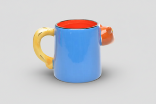 Icelandic horse mug with colorful 3D horse design, blue body, yellow handle, and orange interior labeled “Iceland,” fun Iceland souvenir coffee cup.
