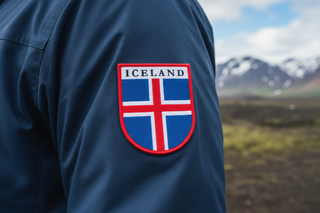 Icelandic flag patch with 'ICELAND' text on a white background 