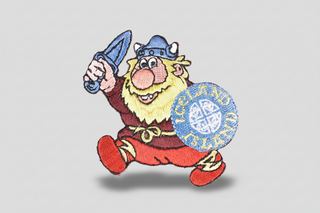 Embroidered patch of a cartoon Viking holding a sword and shield with 'Iceland' on a white background