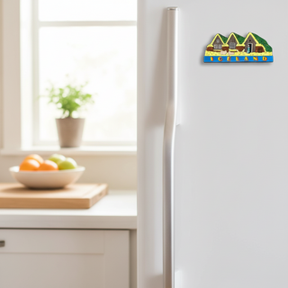 Decorative magnet of Icelandic houses with a person and text on a white background