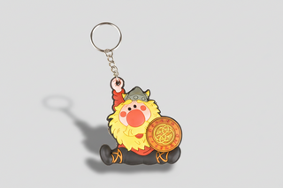 Keychain with cartoon viking character holding a shield on a white background