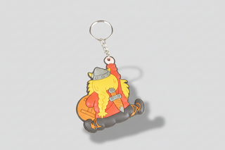 Keychain with cartoon viking character in orange outfit and helmet on a white background