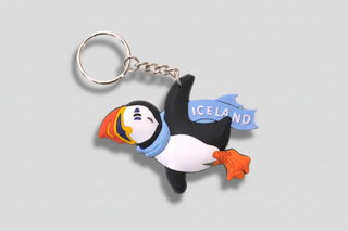 Keychain with a puffin design and 'Iceland' text on a white background