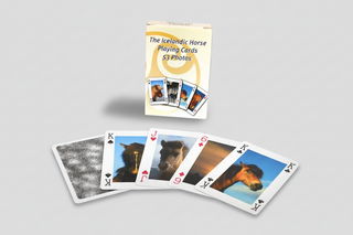 Icelandic Horse playing cards with a deck of cards displayed in front and packaging above on a white background.