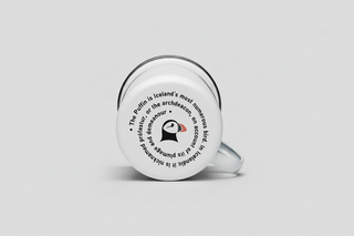 White mug with puffin design and text on a white background
