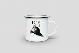 Mug with puffin illustration and 'Iceland' text on a light gray background