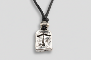 Silver-tone Icelandic Tiwaz rune pendant necklace on black cord, Viking symbol of victory and courage