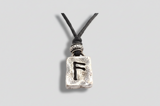 Silver rune pendant with Víska wisdom symbol on black cord necklace