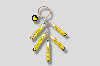 Iceland road sign keychain with yellow direction signs to Reykjavik Geysir and Gullfoss