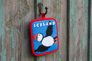 Potholder with puffin design and 'Iceland' text on a blue background