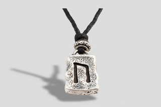Iceland rune necklace with silver-tone Nordic rune pendant on black cord, Viking-inspired Iceland souvenir jewelry.