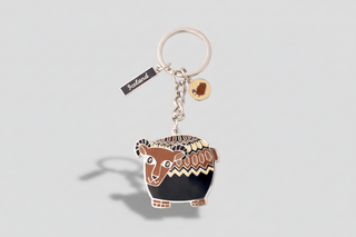 Keychain with bear design and 'Iceland' tag on a white background