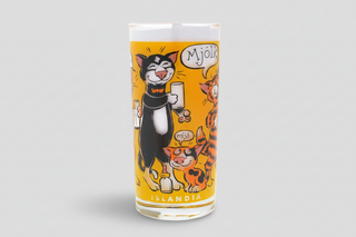 Iceland milk glass with colorful cartoon cats drinking milk, Icelandic text “Mjólk,” fun Iceland souvenir drinking glass.