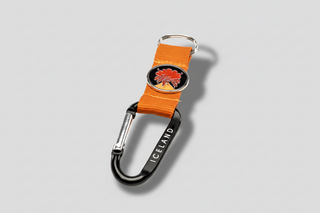 Iceland volcano carabiner keychain with orange strap, eruption charm, and black metal clip engraved Iceland
