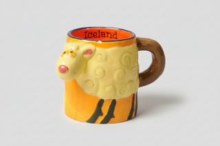 Iceland sheep mug with cute 3D sheep design, orange interior labeled “Iceland,” and brown handle, fun Iceland souvenir coffee cup