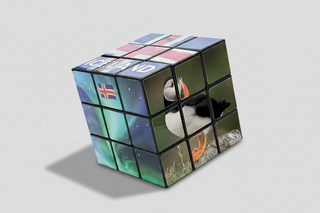Rubik's Cube with various images on each face on a white background