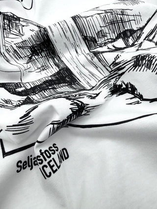 White fabric with black mountain landscape design and 'Seljastoss Iceland' text.