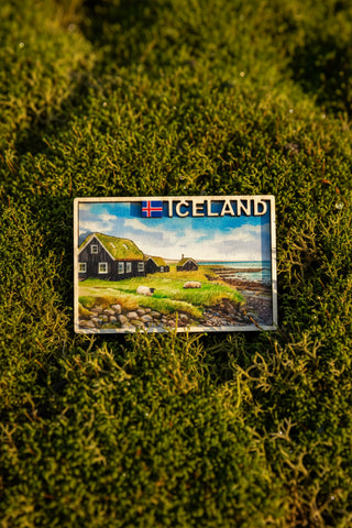 Exclusive wooden Iceland souvenir magnet with Icelandic coastal village, sheep, grass roof houses, and ocean scenery
