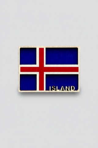 Icelandic flag badge with 'ISLAND' text on a white background