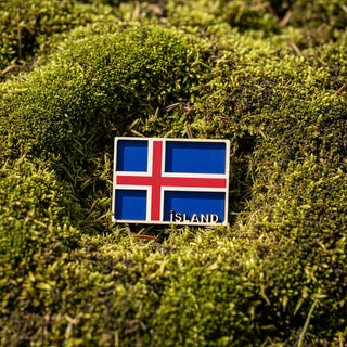 Icelandic flag badge with 'ISLAND' text on a white background