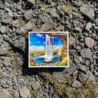 Fridge magnet with Seljalandsfoss waterfall in Iceland on a white background