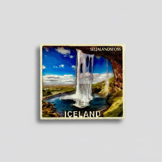 Fridge magnet with Seljalandsfoss waterfall in Iceland on a white background
