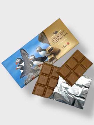 Traditional Icelandic milk chocolate bar with puffin packaging and partially unwrapped milk chocolate squares