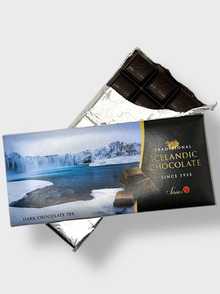 Traditional Icelandic dark chocolate 70 percent, partially unwrapped, showing dark chocolate squares and glacier-inspired packaging