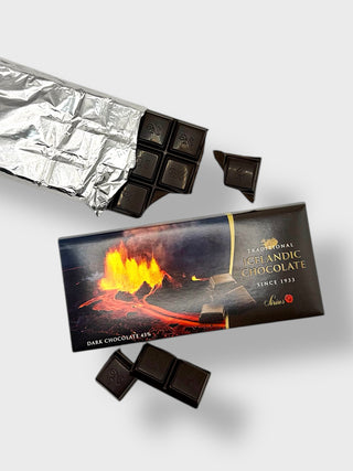 Traditional Icelandic dark chocolate 45 percent, partially unwrapped, showing dark chocolate squares and volcanic lava packaging