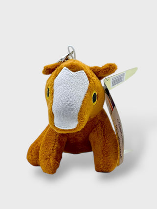 Plush keychain of a brown animal horse with a white patch on a light gray background