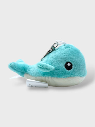 Plush whale-shaped keychain on a white background