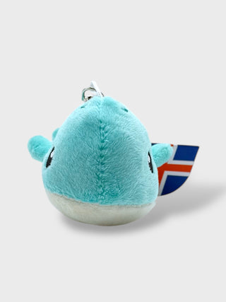 Plush whale  toy  on a light gray background