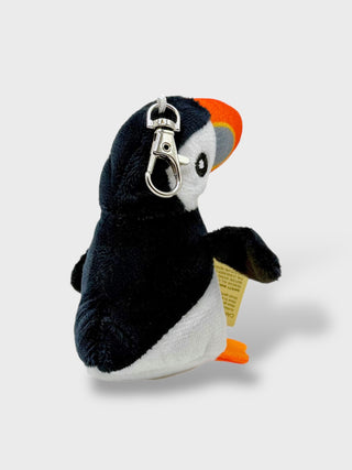 Plush puffin keychain with a tag on a light gray background