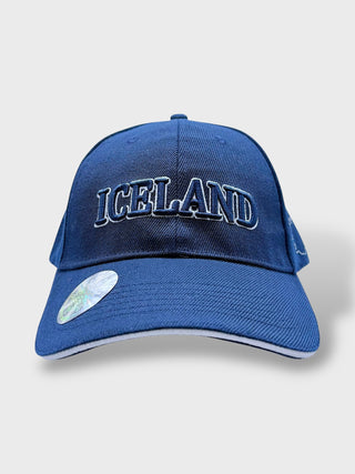 Blue baseball cap with embroidered “Iceland” text on the front, shown on a light background