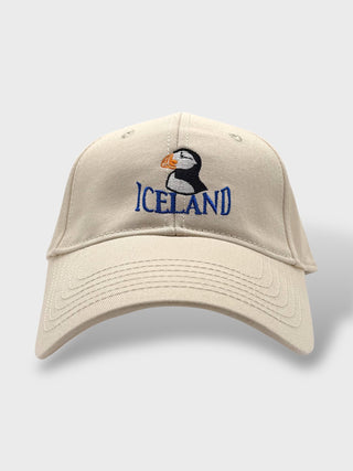 Light-colored baseball cap with embroidered puffin and “Iceland” text on the front.