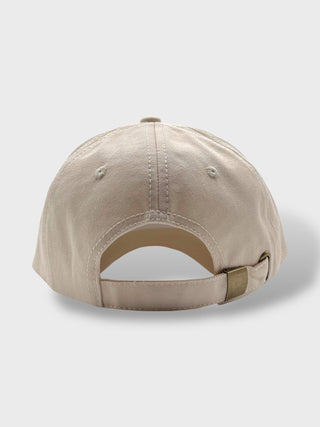 Beige baseball cap on a light gray background