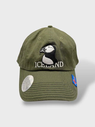 Green baseball cap with embroidered puffin and “Iceland” text, featuring a small Icelandic flag on the side.
