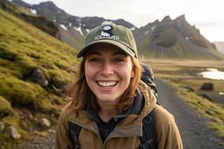 Green cap with puffin design and 'Iceland' text on a light gray background