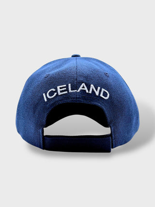 Blue cap with 'ICELAND' text on a light gray background