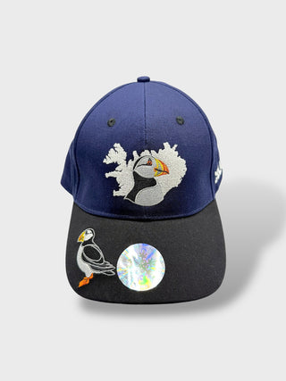 Blue and black baseball cap with embroidered puffin and Iceland map on the front, plus a small puffin detail on the brim.
