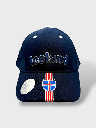 Navy blue baseball cap with embroidered “Iceland” text and an Icelandic flag detail on the front