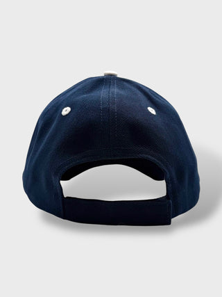 Navy blue baseball cap on a light gray background
