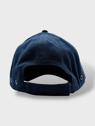Navy blue baseball cap on a light gray background