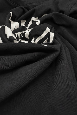 Black fabric with white abstract patterns