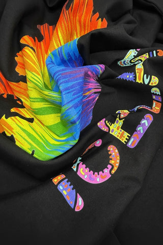 Black hoodie with colorful abstract designs on a dark background