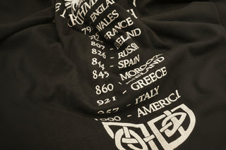 Black t-shirt with white text and designs on a black background
