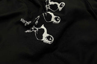 Black fabric with white puffin illustrations