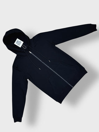 A black zip-up hoodie with a drawstring hood and front pockets, laid flat against a light gray background.
